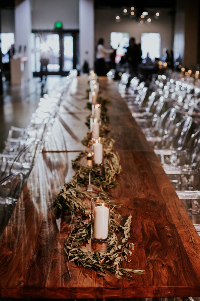 farm table with candles and chairs before a VisionLoft Wedding