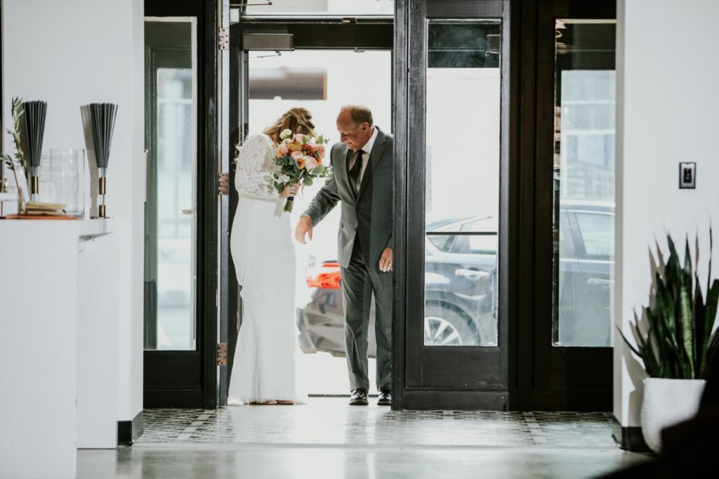 father of bride and bride enter VisionLoft Wedding