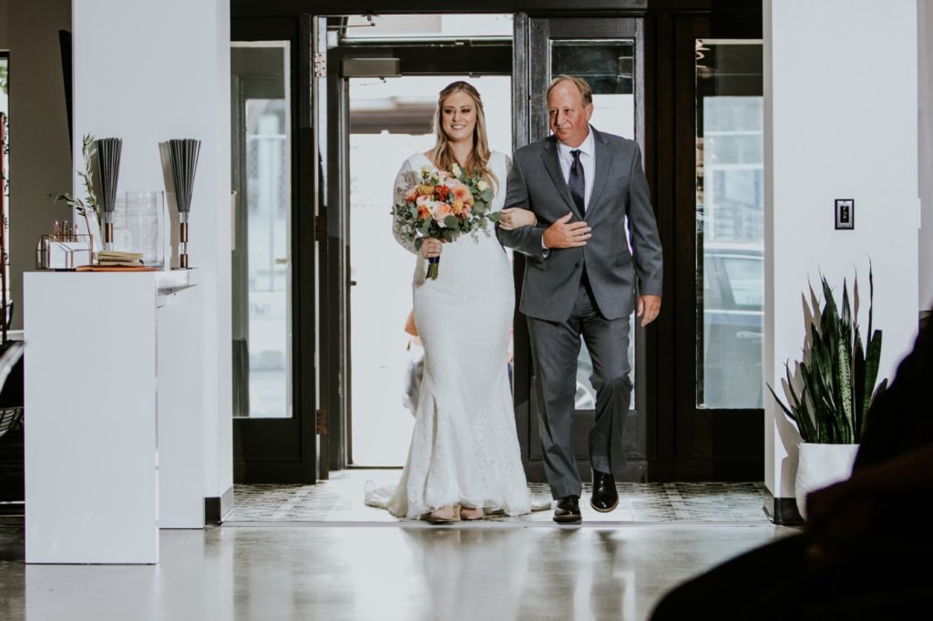 father of bride walks bride down the aisle for her VisionLoft Wedding