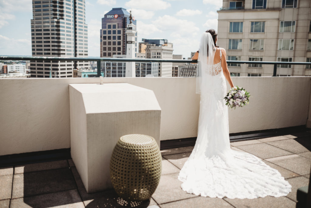 bride on balcony at embassy suites