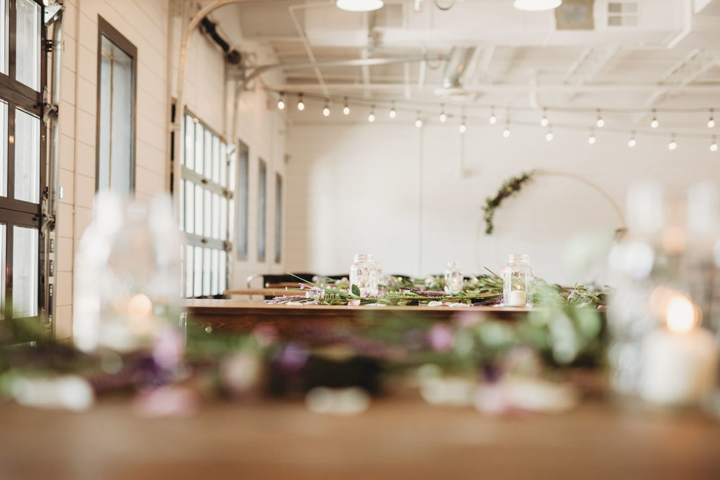 long tables with flowers at a BASH wedding