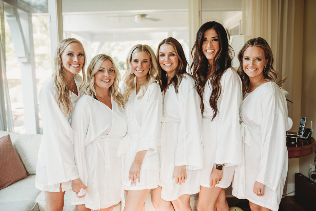 bride with bridesmaids in robes for their indianapolis elopement