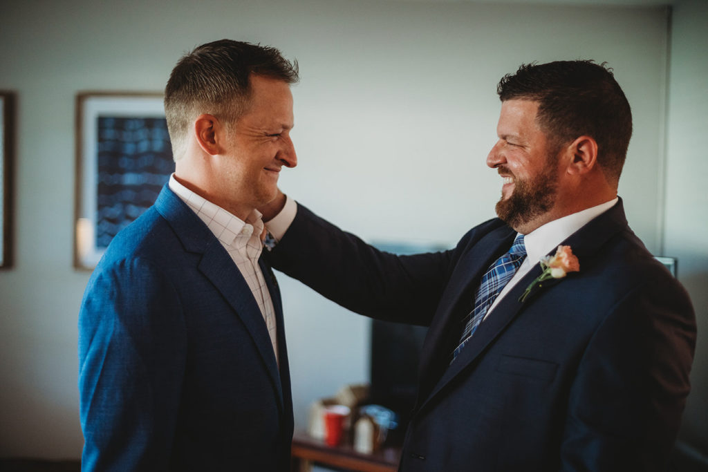 best man pats groom on shoulder in hamilton county