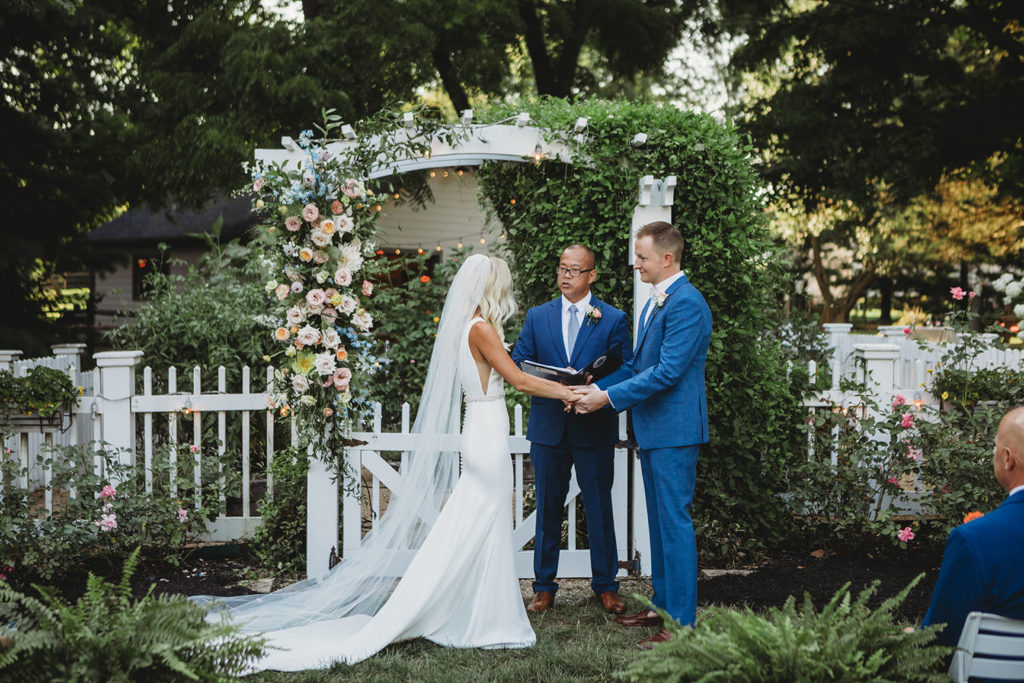 bride and groom being married in backyard during their indianapolis elopement