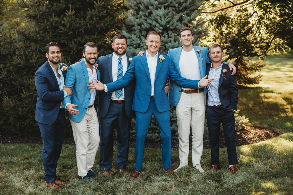 groom and groomsmen hanging out during their zionsville wedding