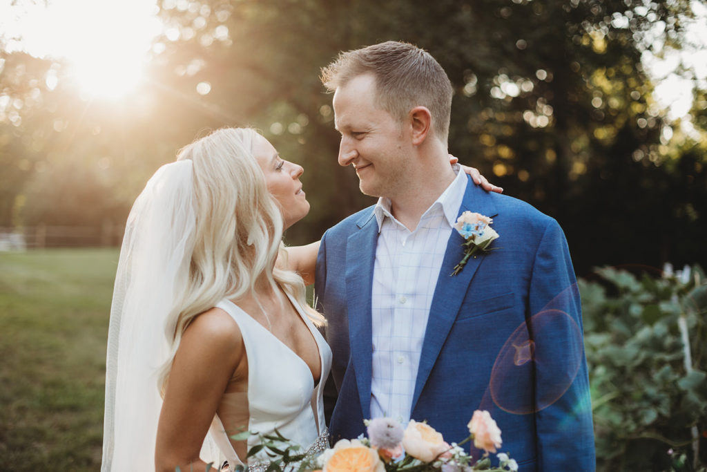 bride and groom look at each other with love while the sun sets during their indianapolis elopement