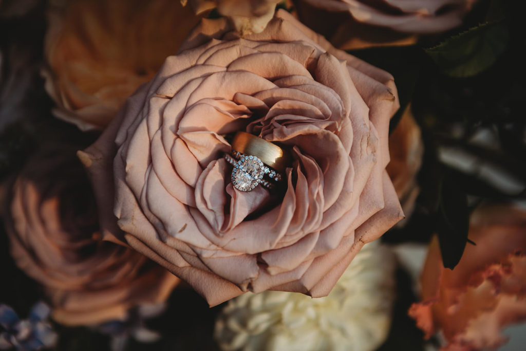 wedding ring and engagement ring in pink flower