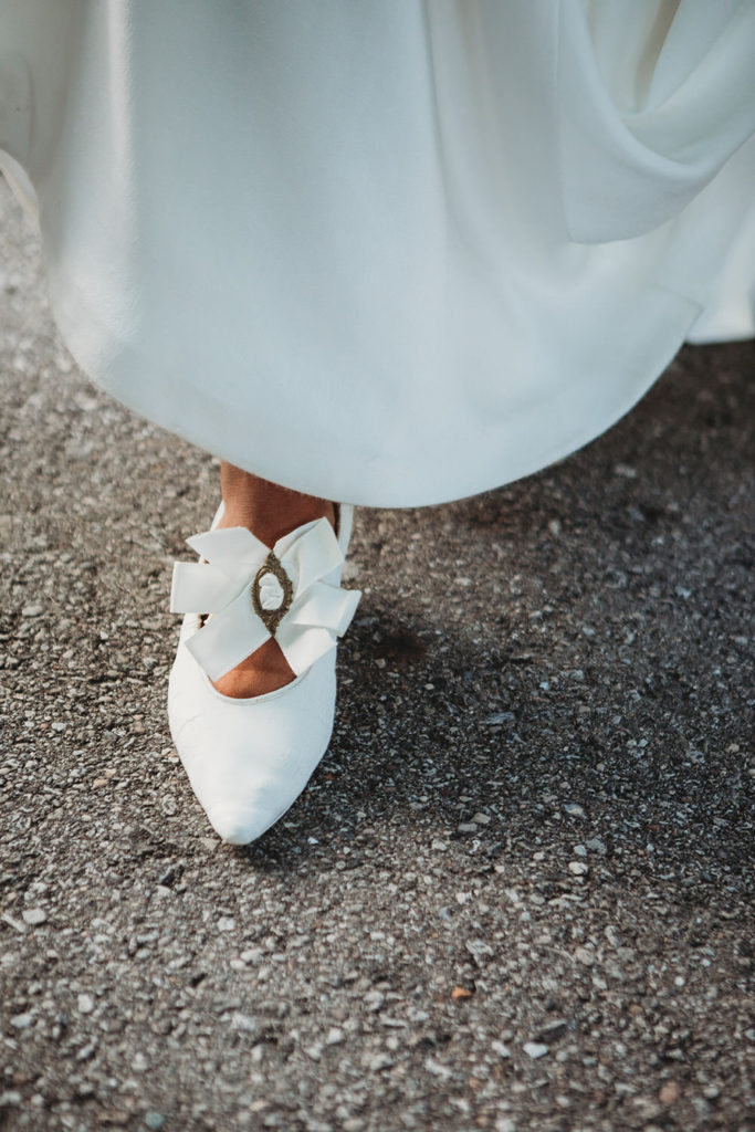 bride wearing great grandmother's wedding shoes on wedding day