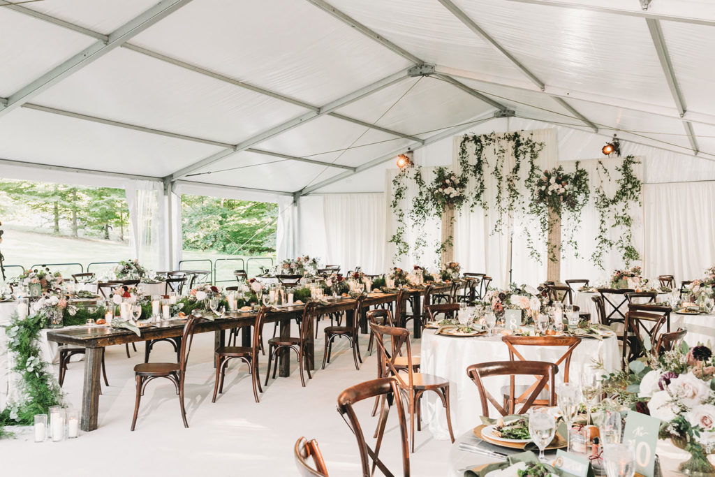 bright and airy photo of florals and candles and tables and chairs at a Carmel Backyard Wedding
