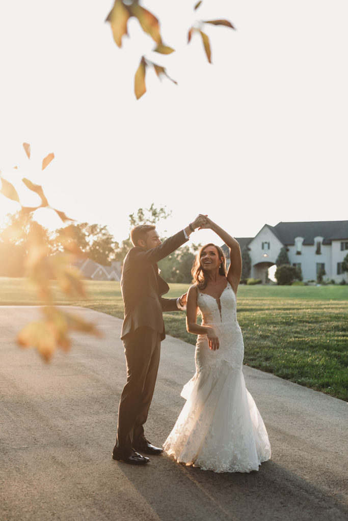 bride and groom dancing at sunset during their Carmel Backyard Wedding