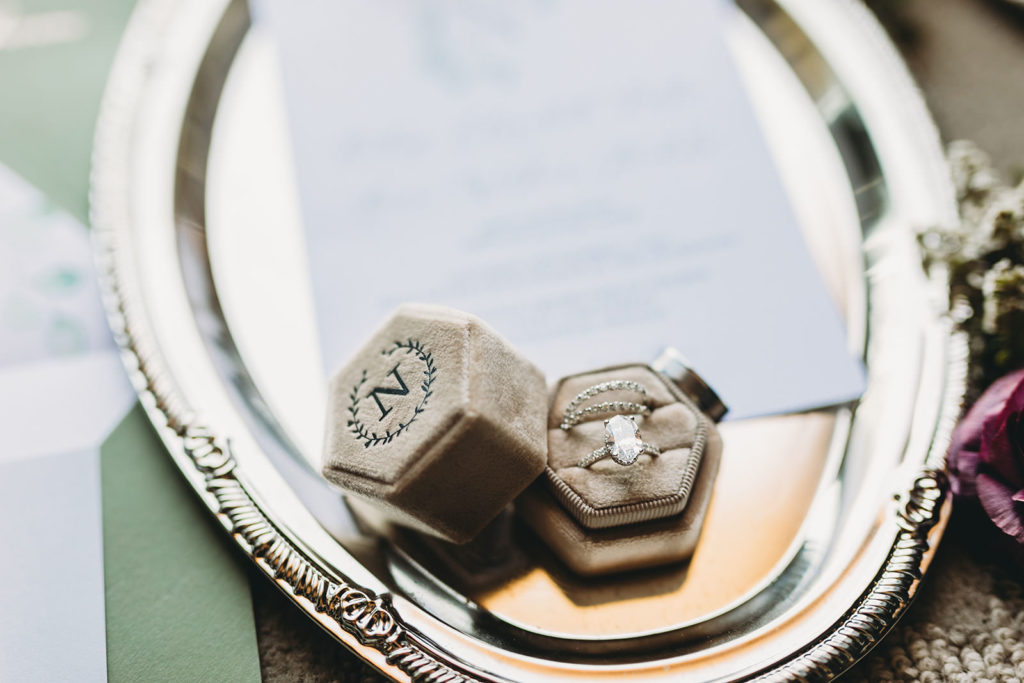 Reis Nichols wedding rings on a silver platter