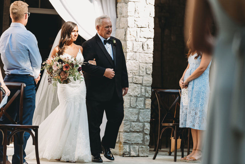 father of the bride walks the bride to her Carmel Backyard Wedding