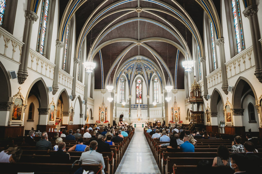 wide shot from back of St. John the Evangelist Catholic Church during a wedding ceremony