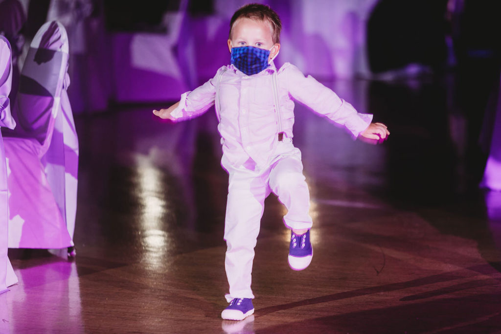 toddler in mask dances at an Indiana Roof Ballroom wedding