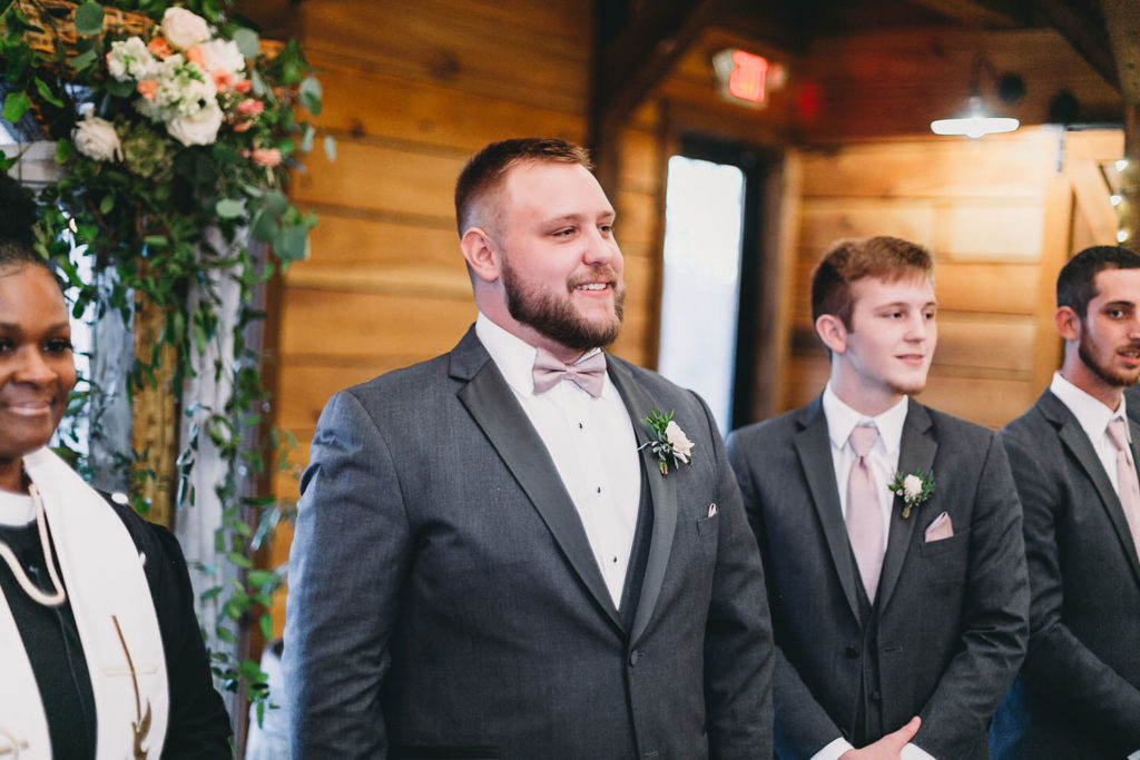 groom sees bride for first time at wedding
