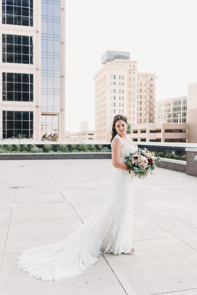 bride holds flowers during a Regions Tower Wedding Celebration