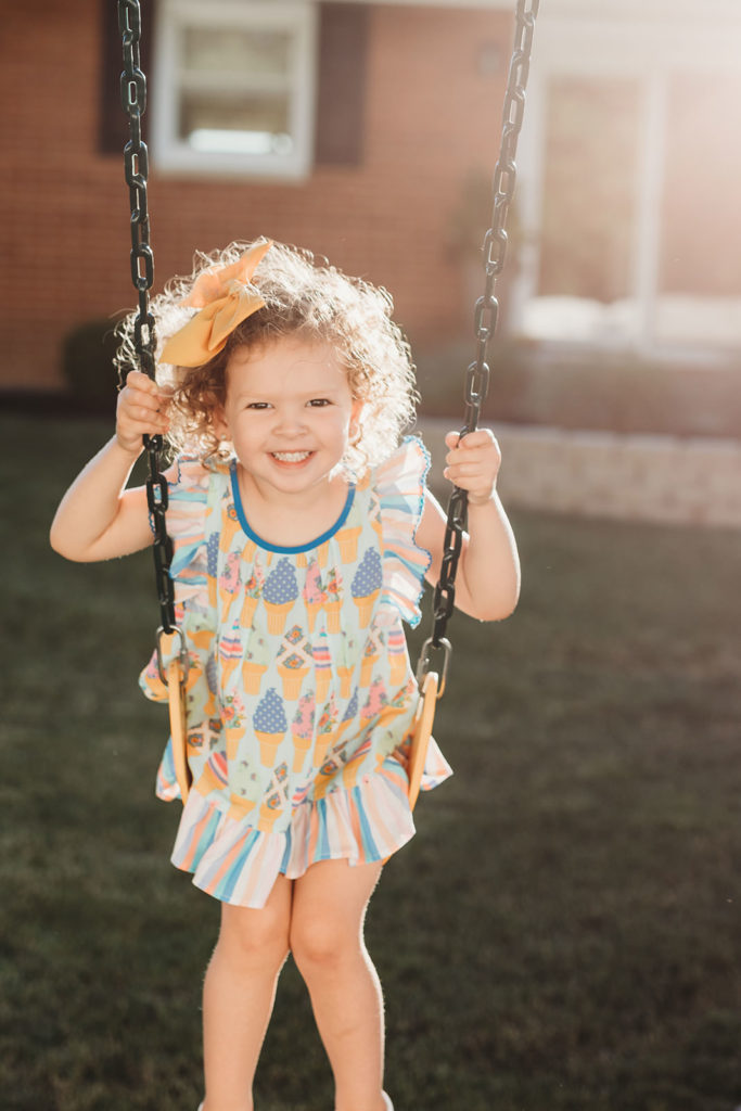 toddler swings at sunset in noblesville family photography