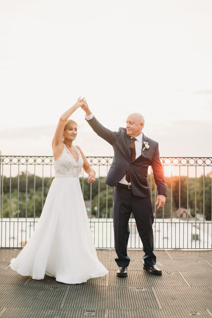 bride and groom dance on roof at mill top wedding noblesville