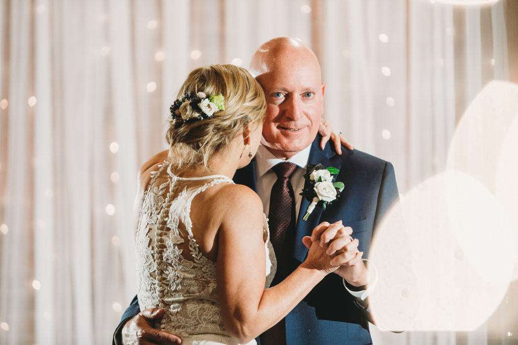 bokeh and brides and grooms and curtains at mill top wedding noblesville