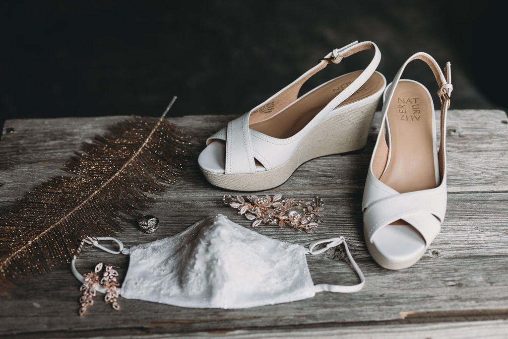 shoes, face mask, rings, and other items at a Franklin Barn Wedding