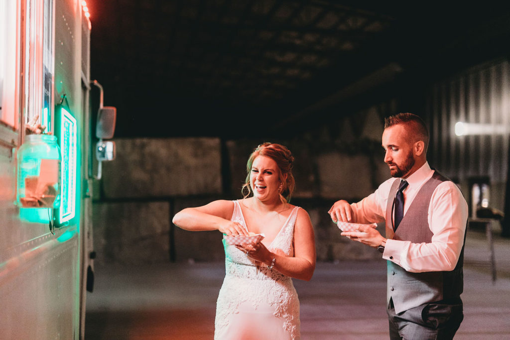 bride and groom receiving tacos from pili's party taco truck at a woolery mill wedding