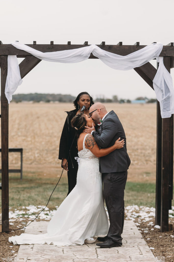 mid shot of a first kiss at a Franklin Barn Wedding