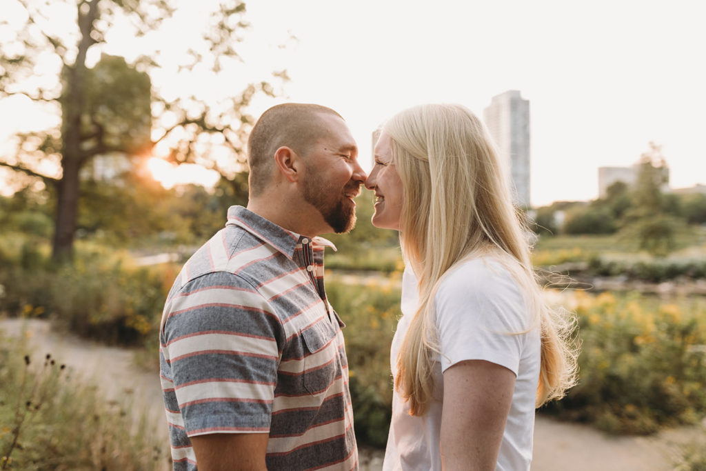 man and woman touch noses during Lincoln Park engagement photos