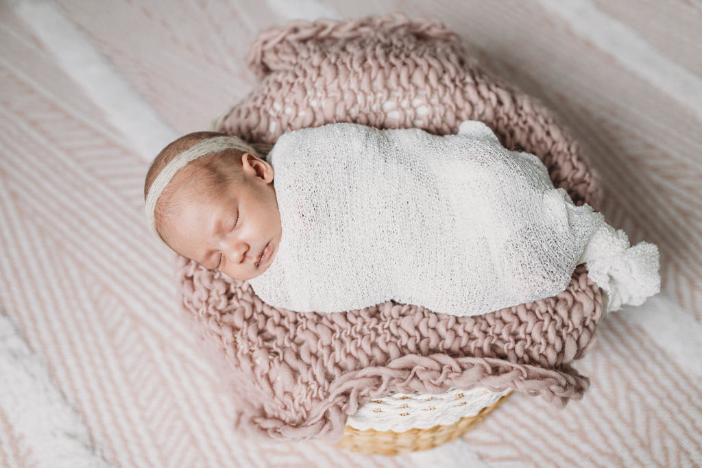 baby with white headband captured by their Indy Newborn Photographer