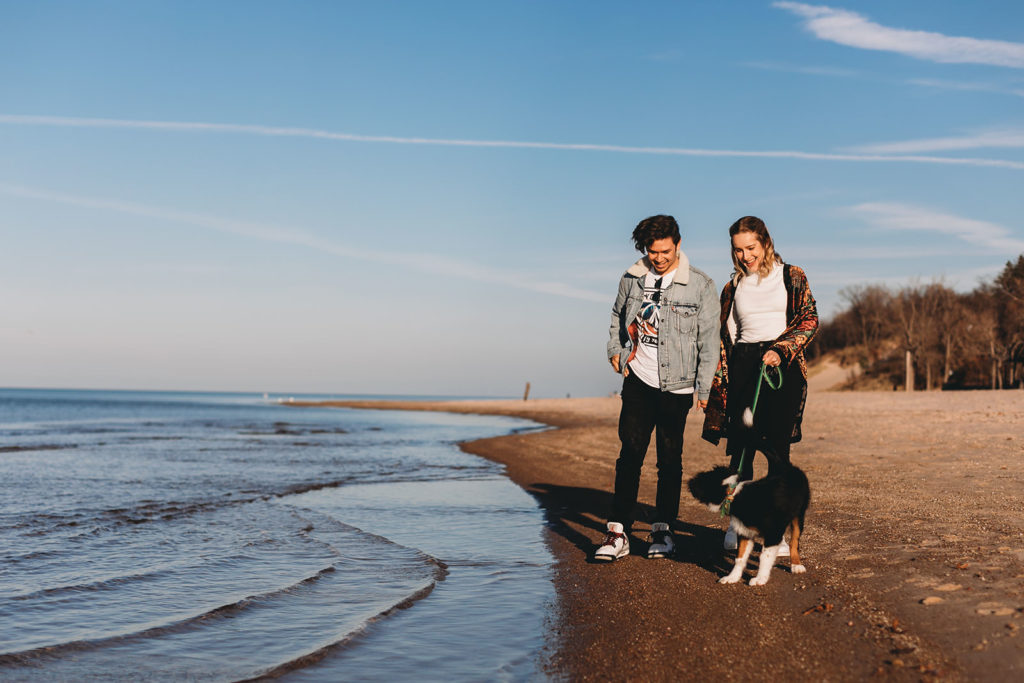 young couple walk their dog in Indiana Dunes National Park