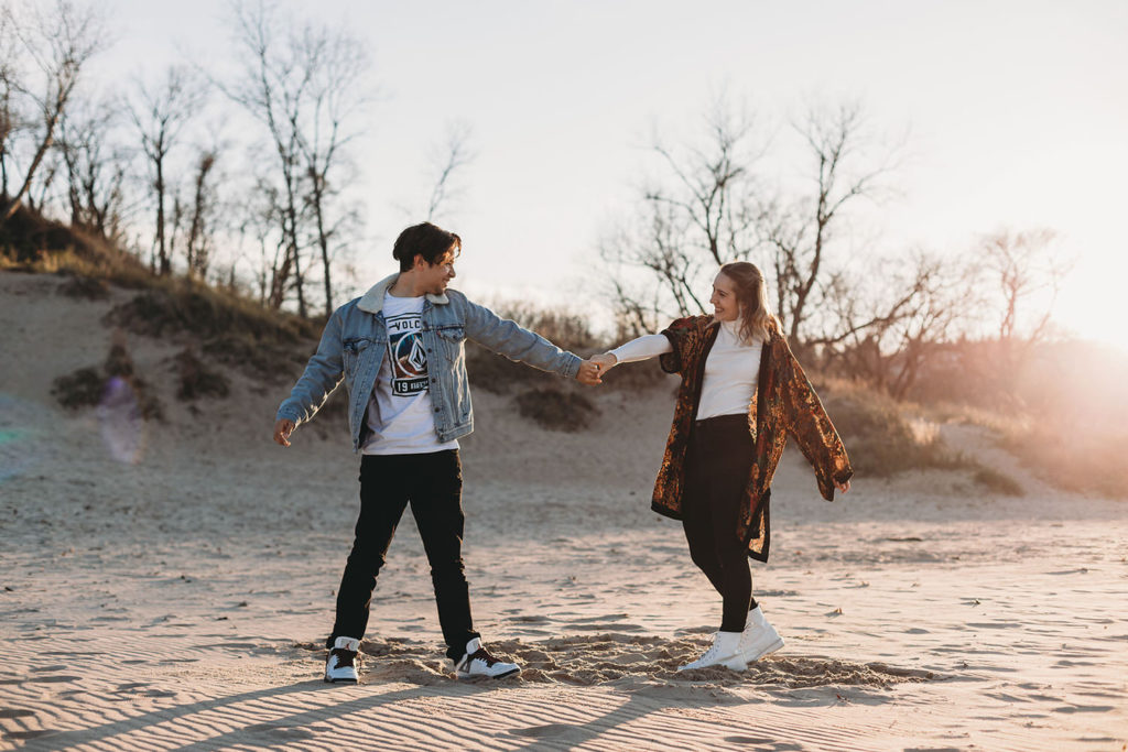 Engaged Couple dance romantically during their Indiana Dunes engagement photos