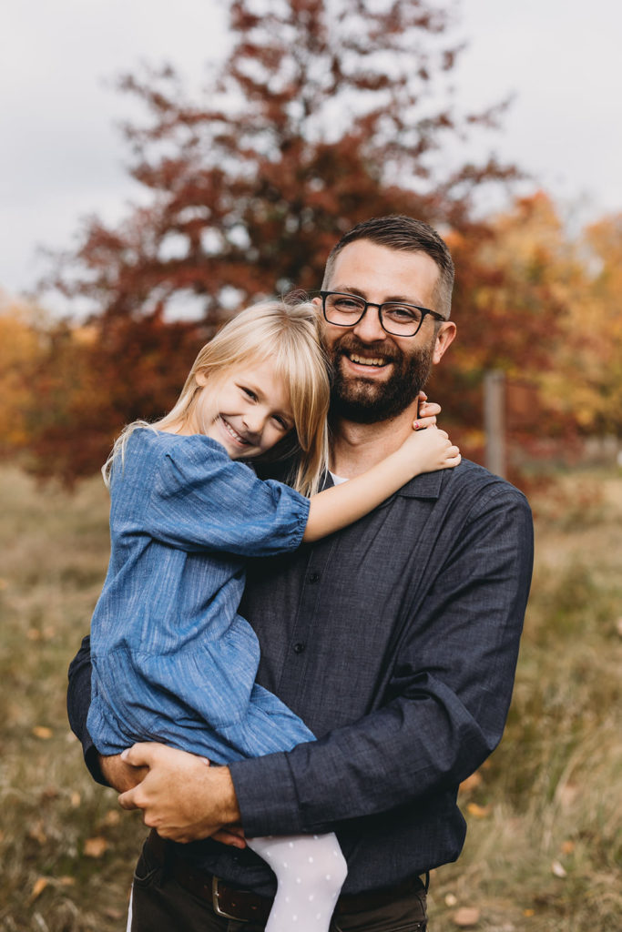 daughter hugging dad captured by a Carmel Family Photographer