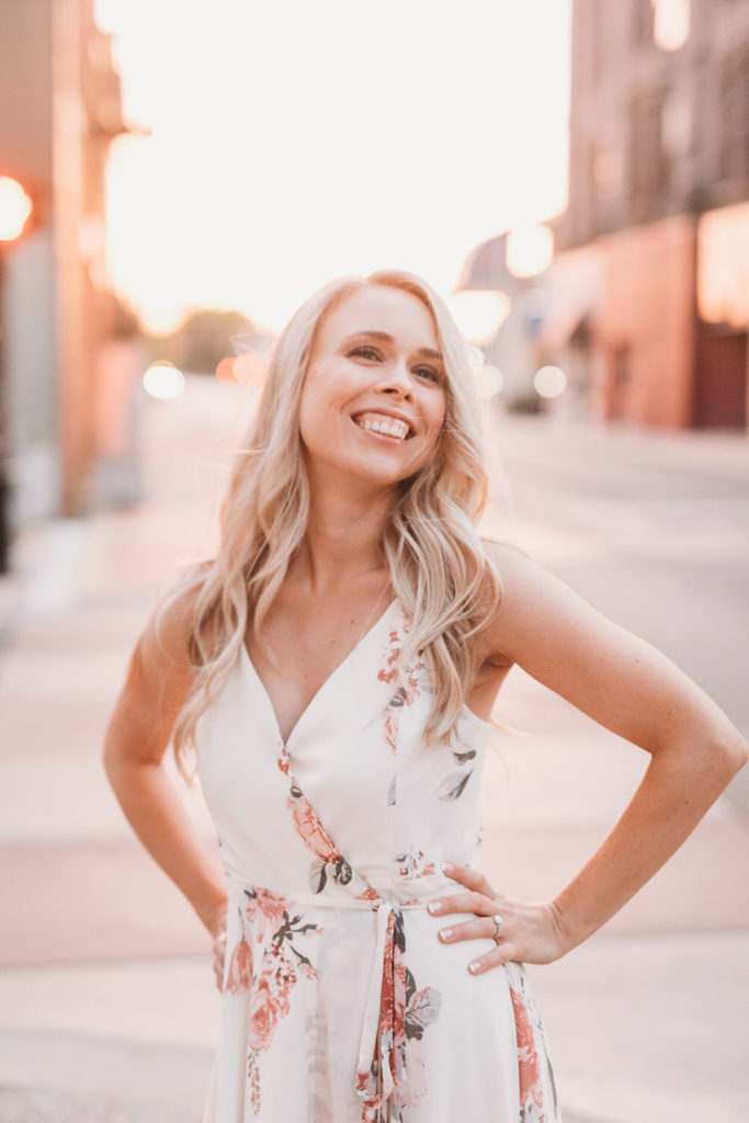 blonde woman at sunset on the street during Downtown Muncie Engagement session