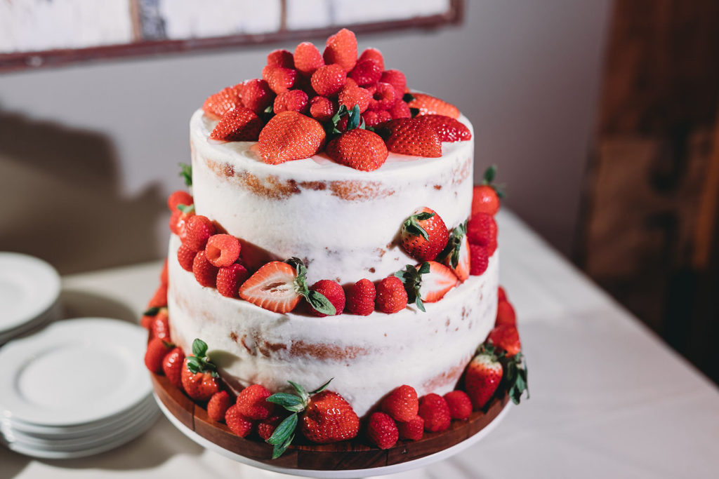 strawberries cover a winter wedding cake