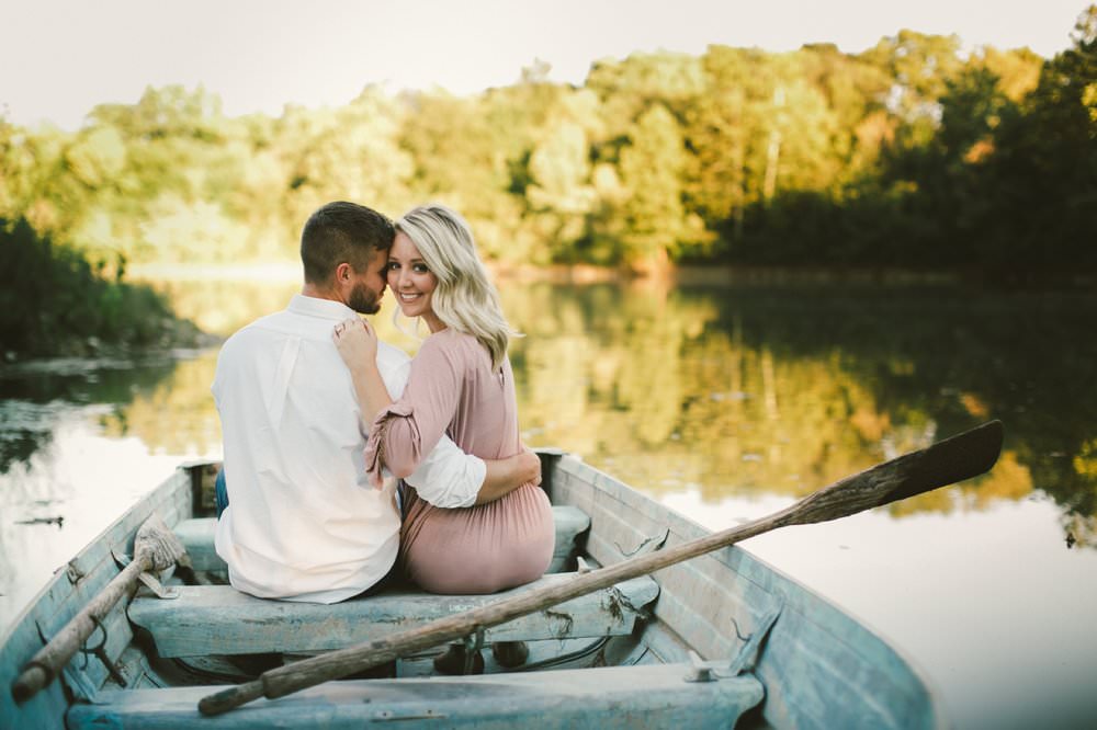 Man and Woman sit in boat in one of the Best Indianapolis Engagement Photo Locations