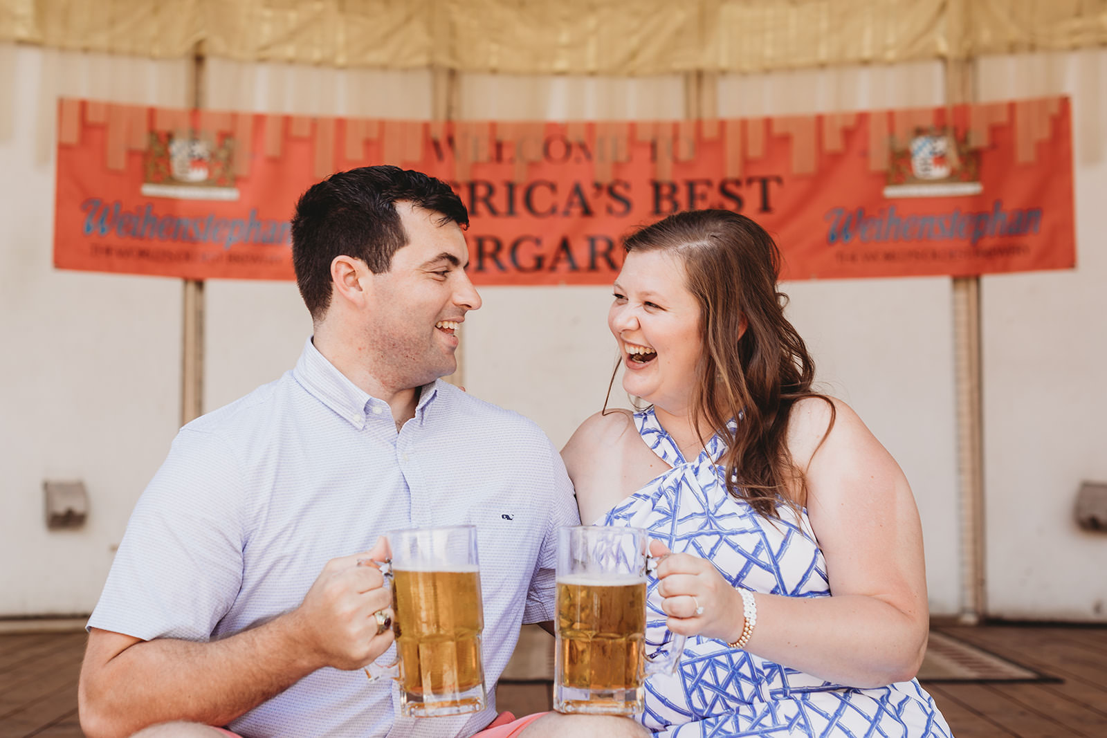 man and woman drinking beer in biergarten during their Rathskeller engagement