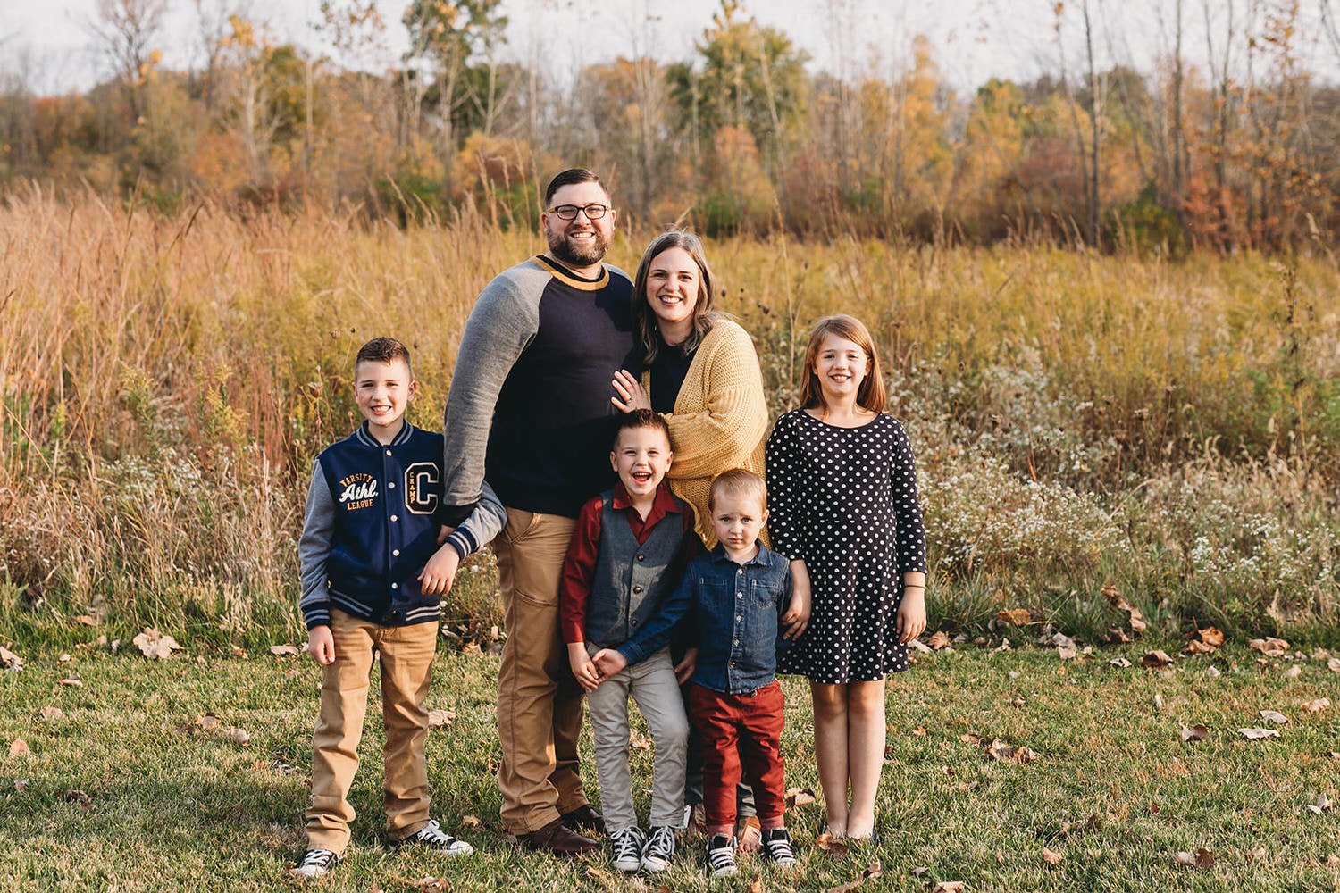 family of 6 in front of tall grass in these Carmel Fall Family Photos