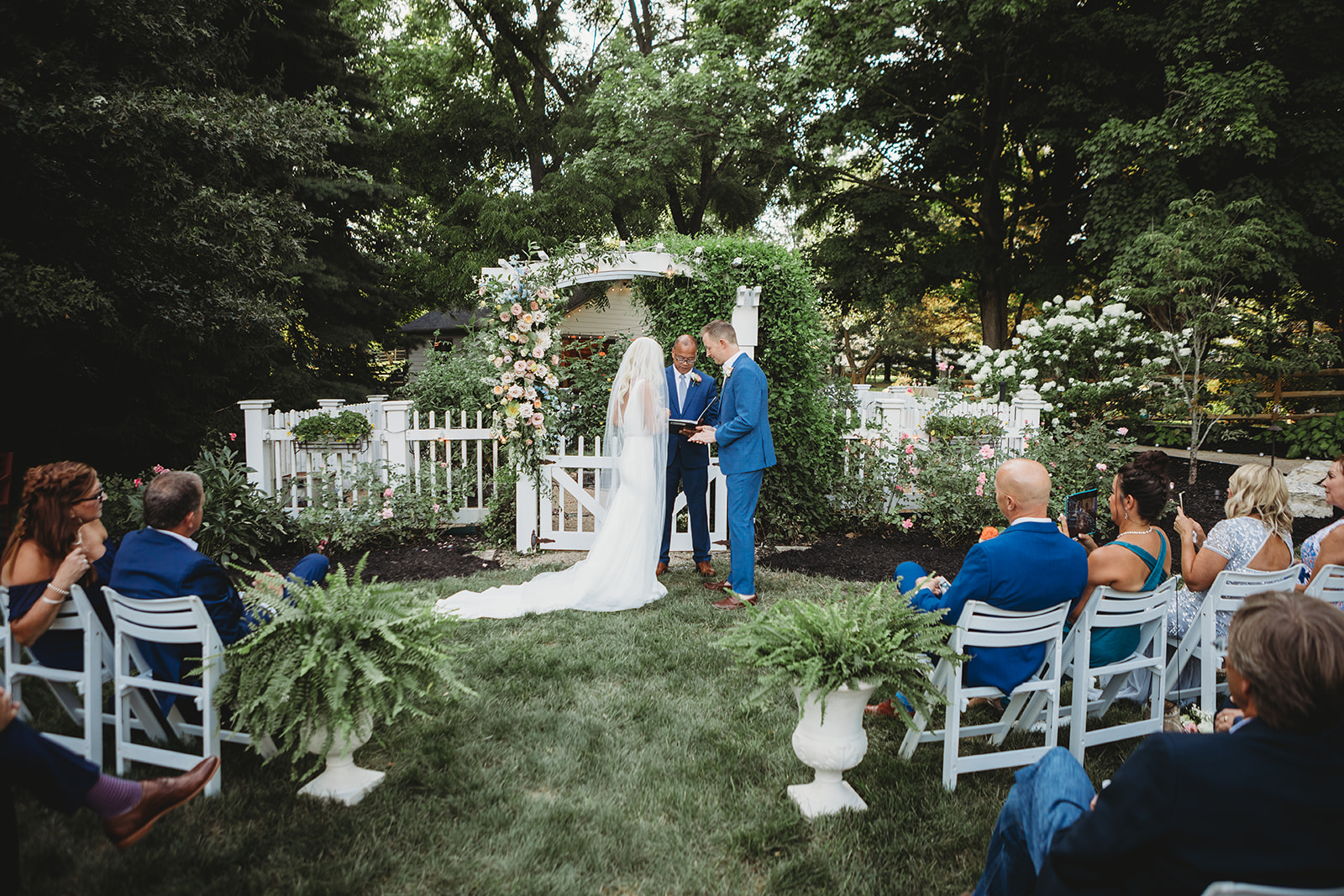backyard home wedding with trellis and flowers