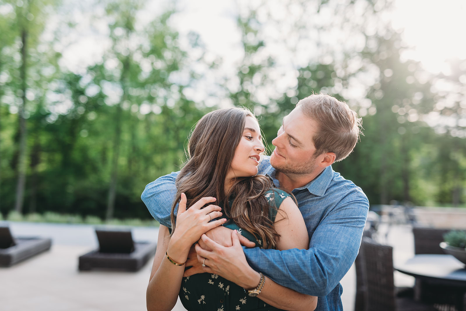 man and woman prepare to kiss during their carmel at-home engagement session