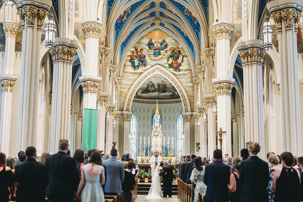 wide shot of bride and guests at the Basilica of the Sacred Heart for a University of Notre Dame Wedding