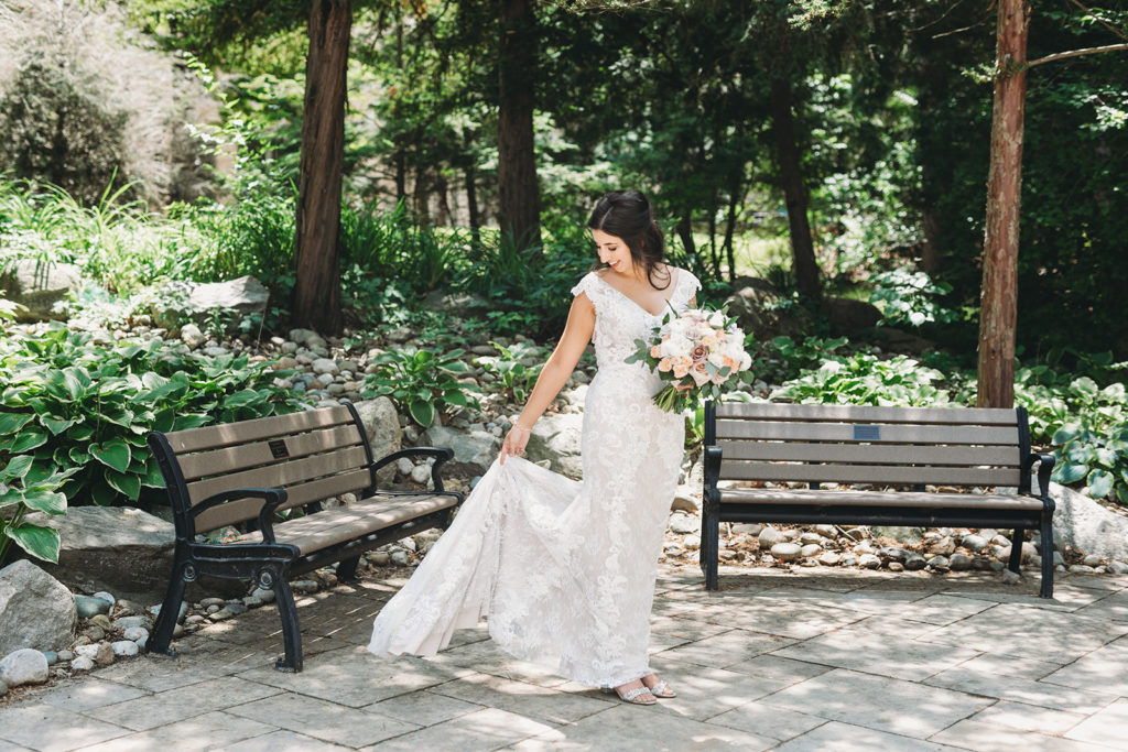 bride plays with dress before her Notre Dame Wedding