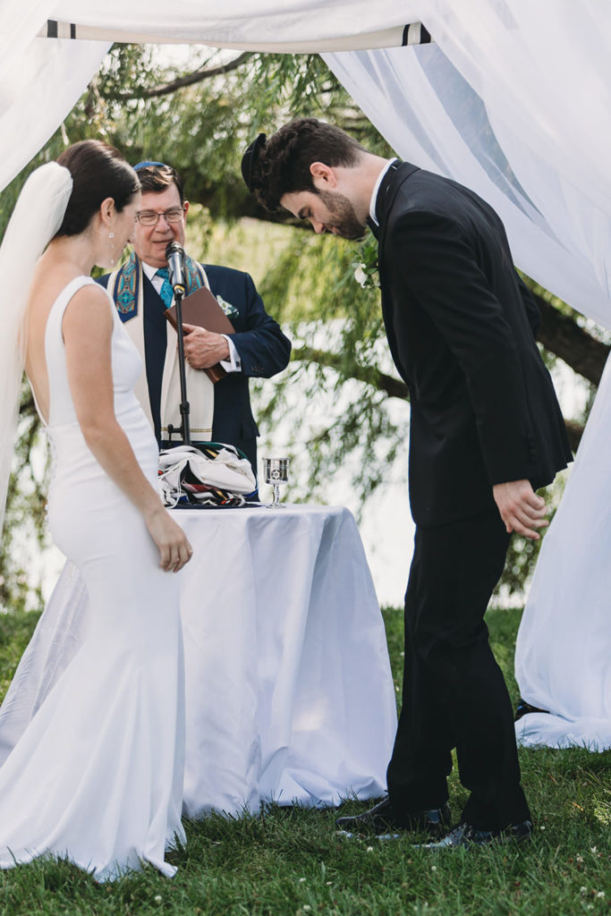 groom stomps glass with such force his yarmulke flies off his head at his charming coxhall gardens wedding