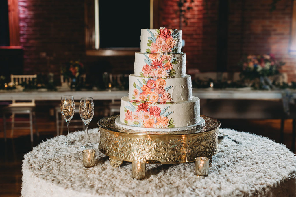 gorgeous cake with flower icing at a charming mavris wedding