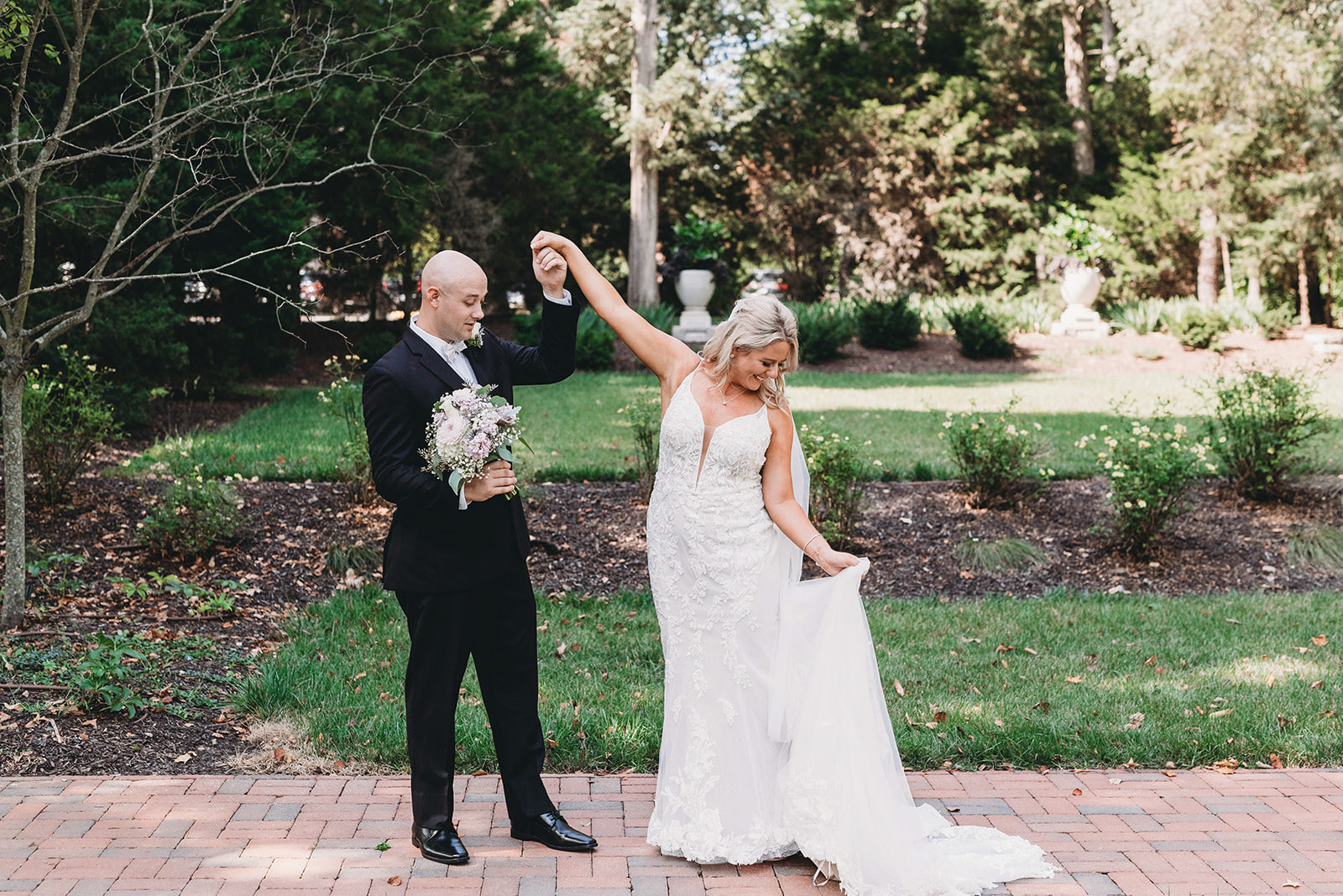 bride and groom dance outside Allison Mansion/Riverdale during their Marian University Wedding