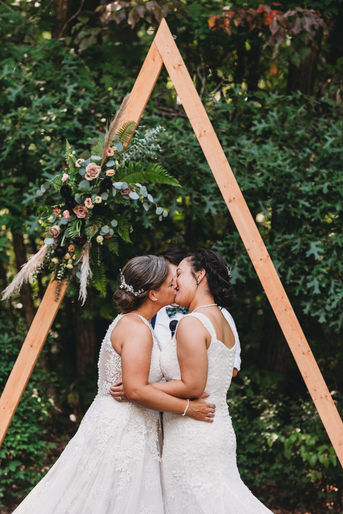two brides share their first kiss during their Martinsville wedding