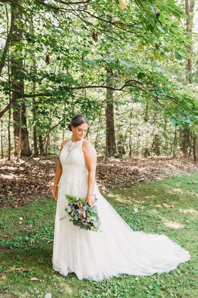 bride with brown hair in the woods during a Martinsville wedding