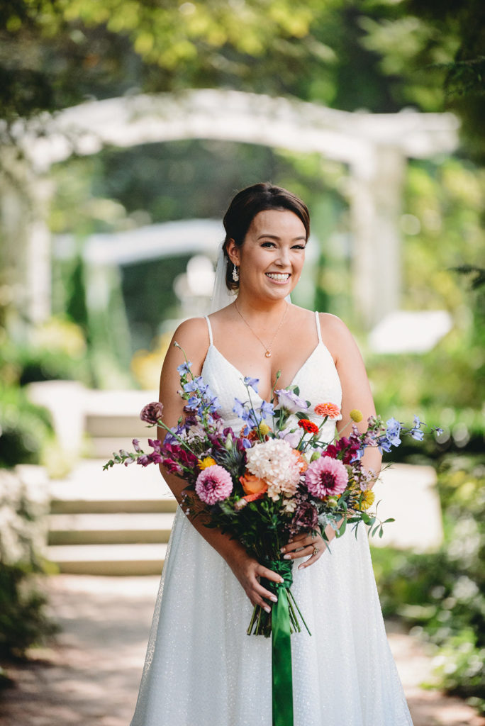 bride with flower bouquet during a Newfields Lilly Terrace wedding