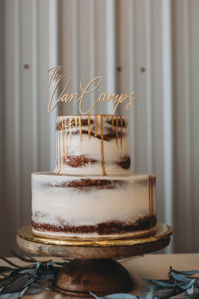 wedding cake with white frosting and gold frosting dripping down the front during a Richmond Indiana Wedding