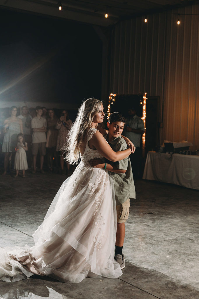 bride dances with younger brother during a Richmond Indiana Wedding