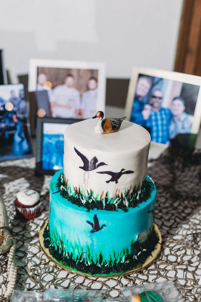 groom and best man hunting cake with lots of ducks during a Richmond Indiana Wedding