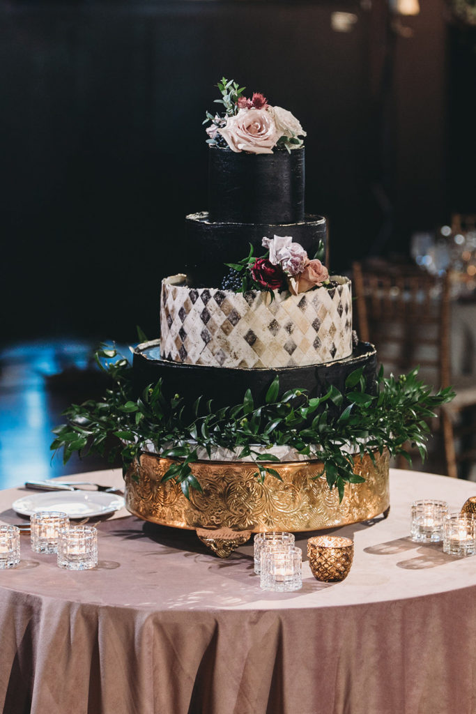 4 tier black wedding cake during a scottish rite cathedral wedding